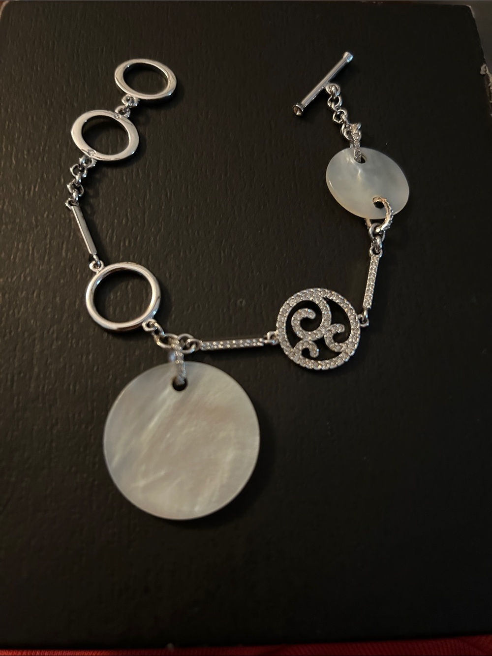 Silver-Tone Mother-of-Pearl Disc bracelet with Swarovski Pave stones.